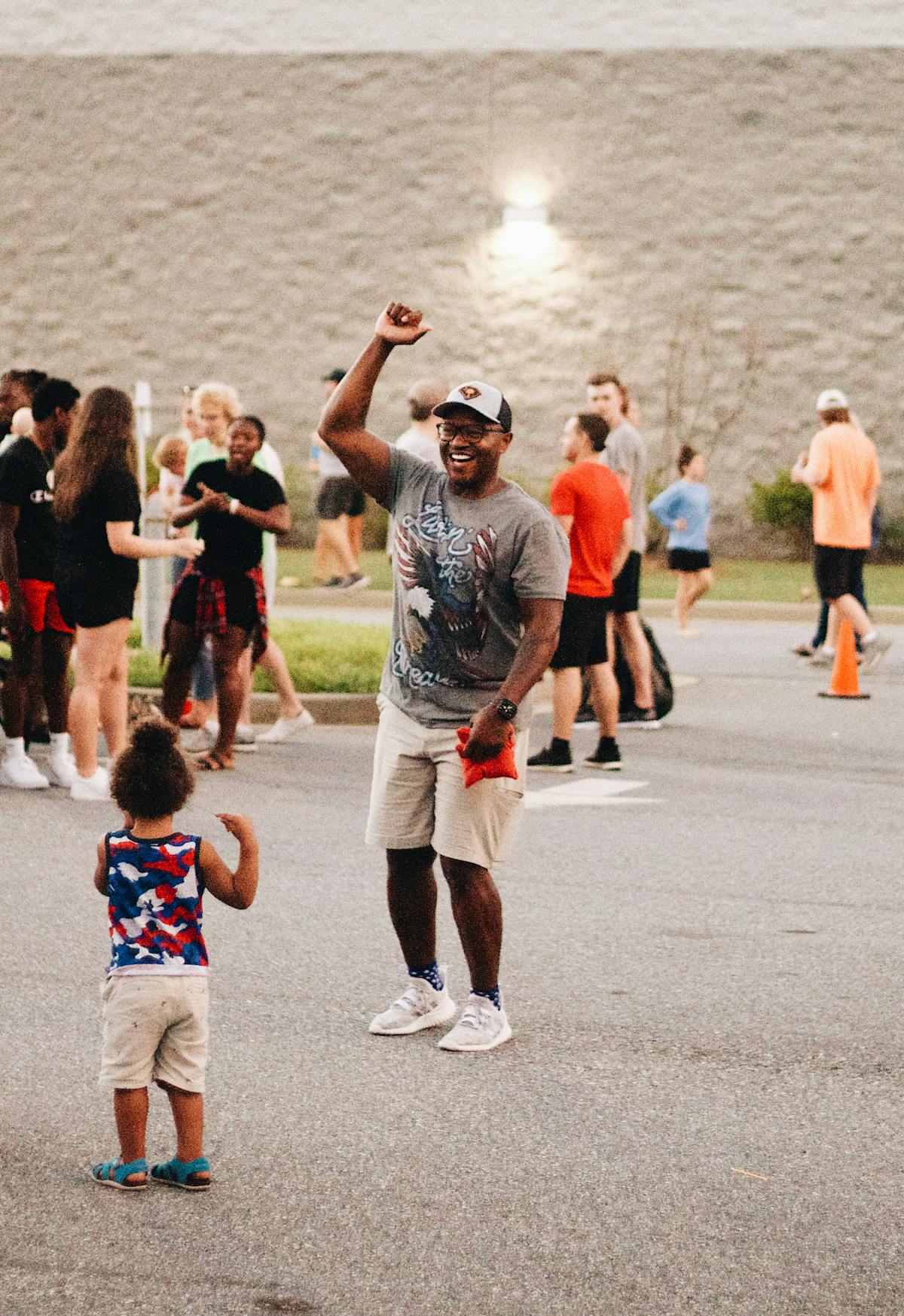 Community members celebrating at festive outdoor neighborhood gathering