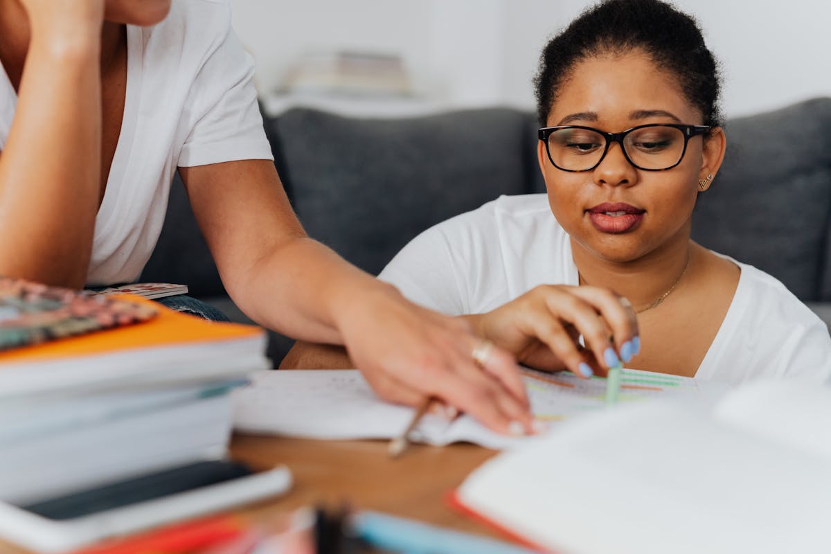 African American woman in tutoring session studying